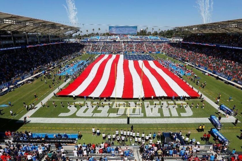 A giant flag covered the field for the national anthem before the Los Angeles Chargers played the Kansas City Chiefs at the StubHub Center in Carson on Sept. 9, 2018. (Photo by K.C. Alfred/San Diego Union-Tribune)