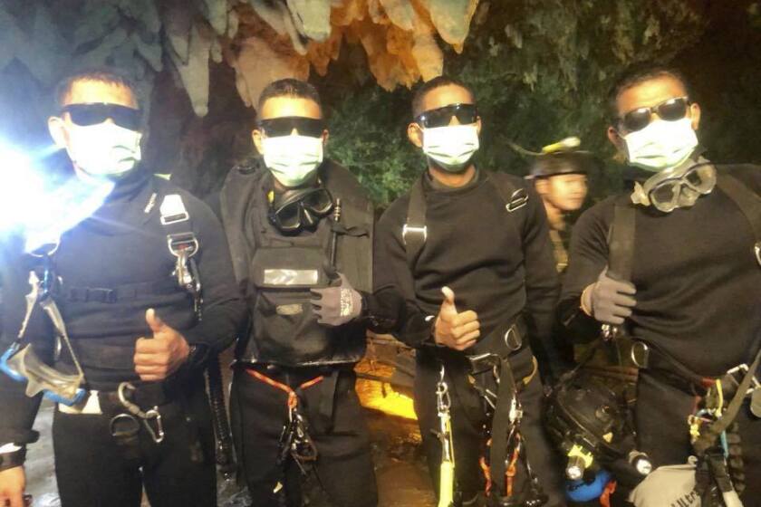The last four Thai navy SEALs come out safely July 10 after completing a rescue mission inside a cave near Mae Sai where 12 boys and their soccer coach were trapped.