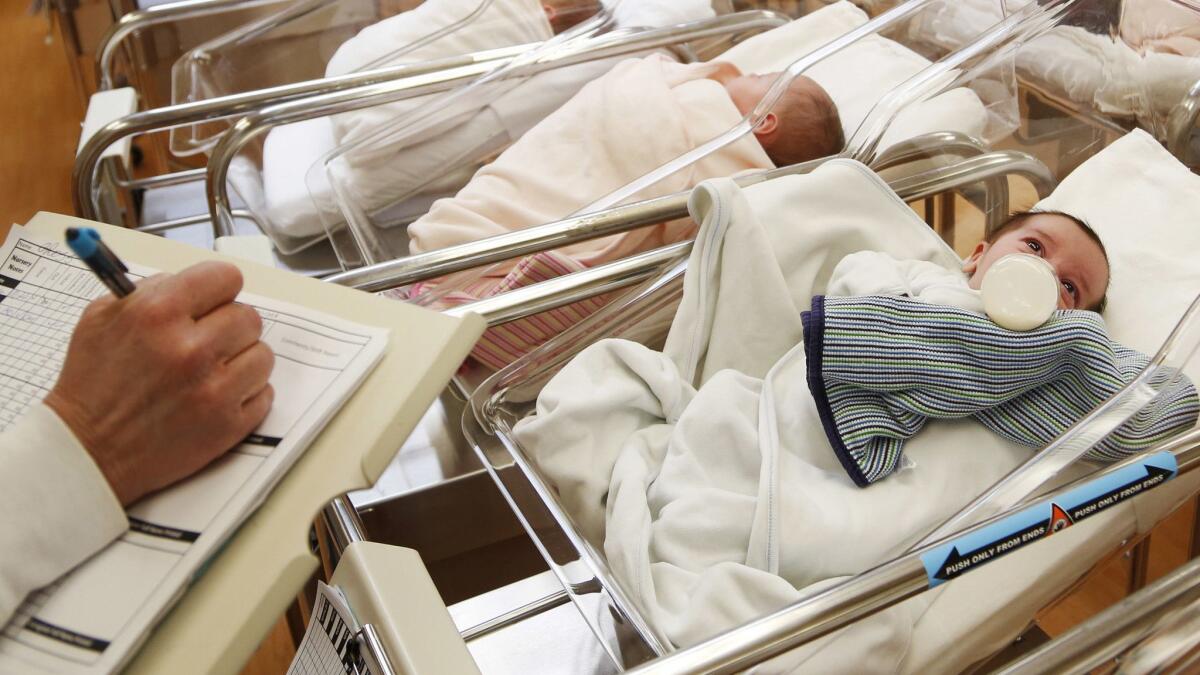 Newborn babies in a postpartum recovery center in upstate New York. A new report says births in the U.S. hit a 32-year low last year.