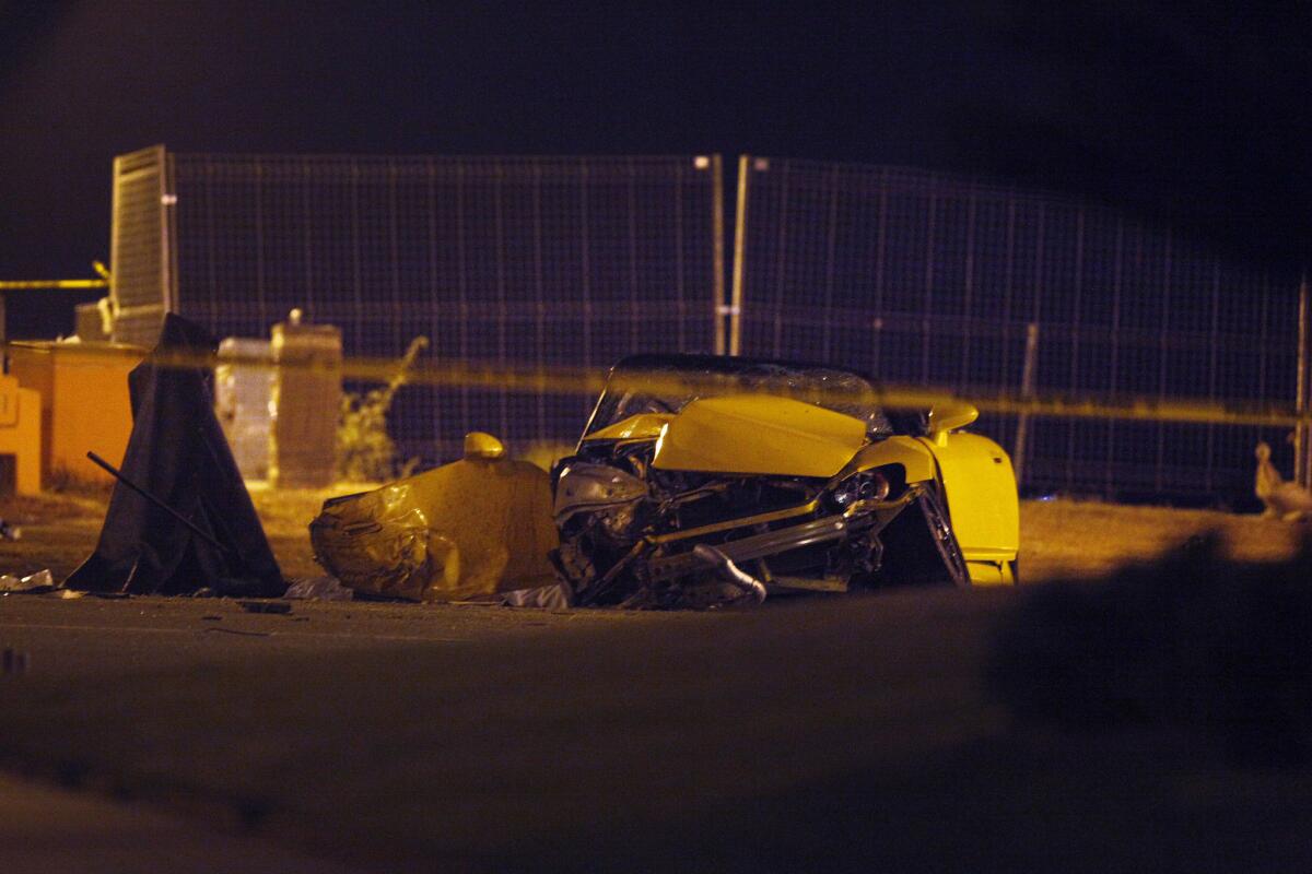 Shown is the wreckage of a crash that killed one person and injured another Monday night at Ocean Boulevard and Orizaba Avenue in Long Beach.