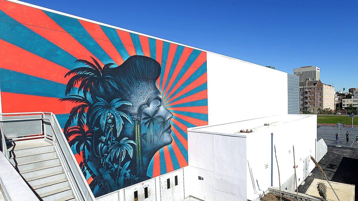 The L.A. school district plans to remove this mural from the Robert F. Kennedy Community Schools complex. Activists say the mural suggests the Japanese imperial battle flag, a symbol they regard as hateful as a swastika. The artist, Beau Stanton, denies any connection.