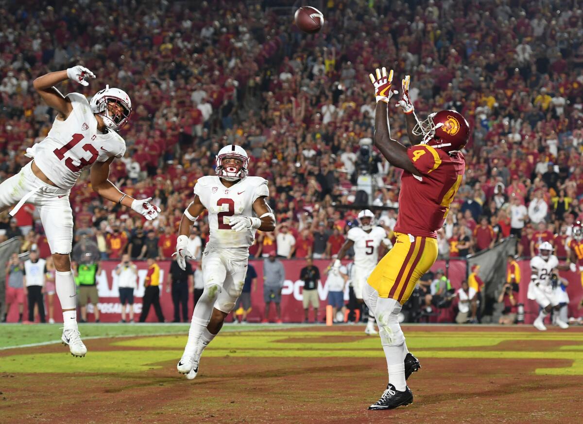USC receiver Steven Mitchell Jr. catches a touchdown pass in front of Stanford defenders during the fourth quarter at the Coliseum on Sept. 9. USC and Stanford will meet again this Friday in the Pac-12 championship game.