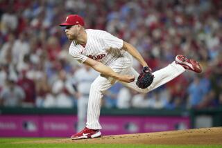 Philadelphia Phillies' Zack Wheeler pitches during the first inning of Game 1 in an NL wild-card baseball playoff series against the Miami Marlins, Tuesday, Oct. 3, 2023, in Philadelphia. (AP Photo/Matt Slocum)