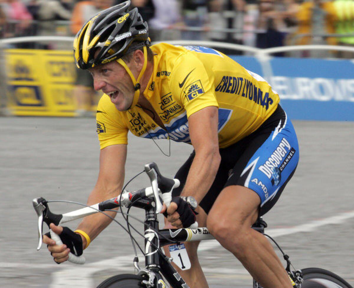 Lance Armstrong rides during the 2005 Tour de France. Nike, whose swoosh logo you can see on the jersey on his left arm, said Wednesday that it was cutting all ties with Armstrong.