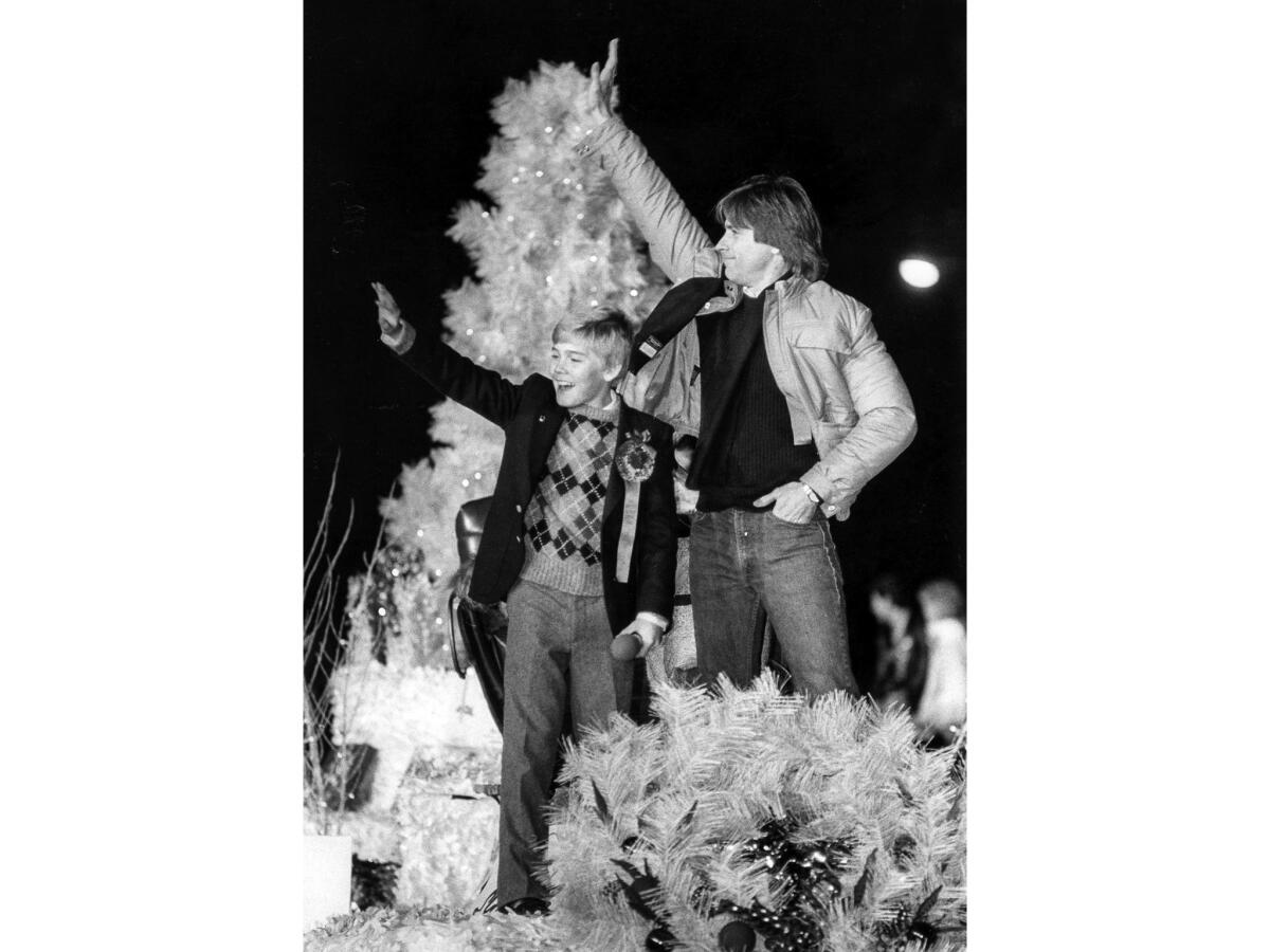 Nov. 28, 1982: Ricky Schroder and Joel Higgins, who starred as father and son in TV's "Silver Spoons," wave from a float in the Hollywood Christmas Parade.