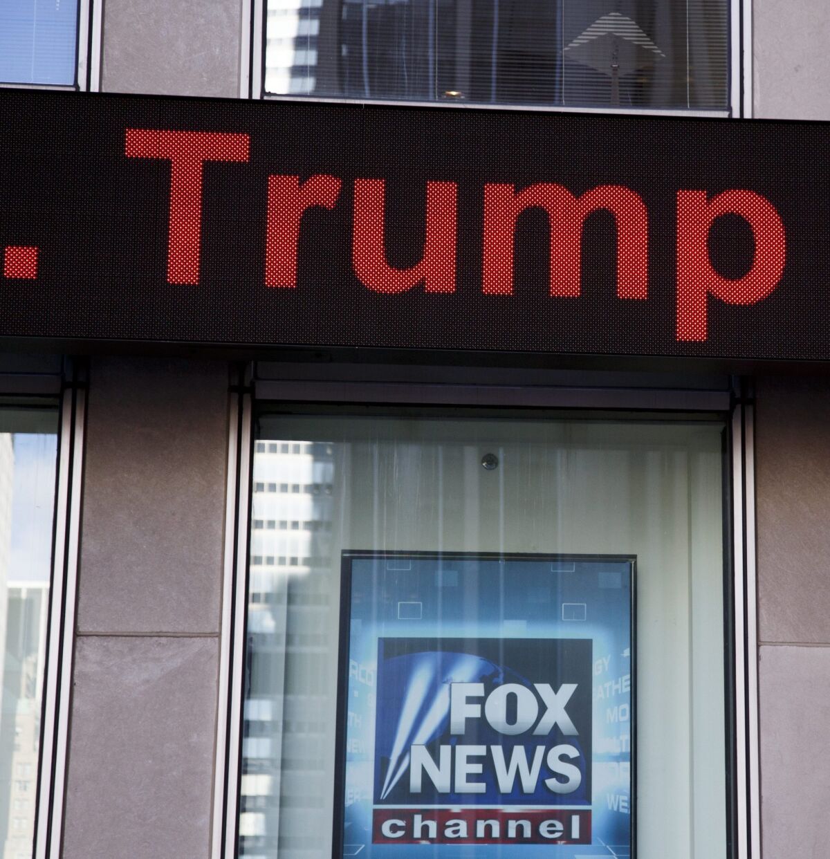 President-elect Donald Trump's name passes on a news ticker over a sign on the Fox News studios in New York on Nov. 22.