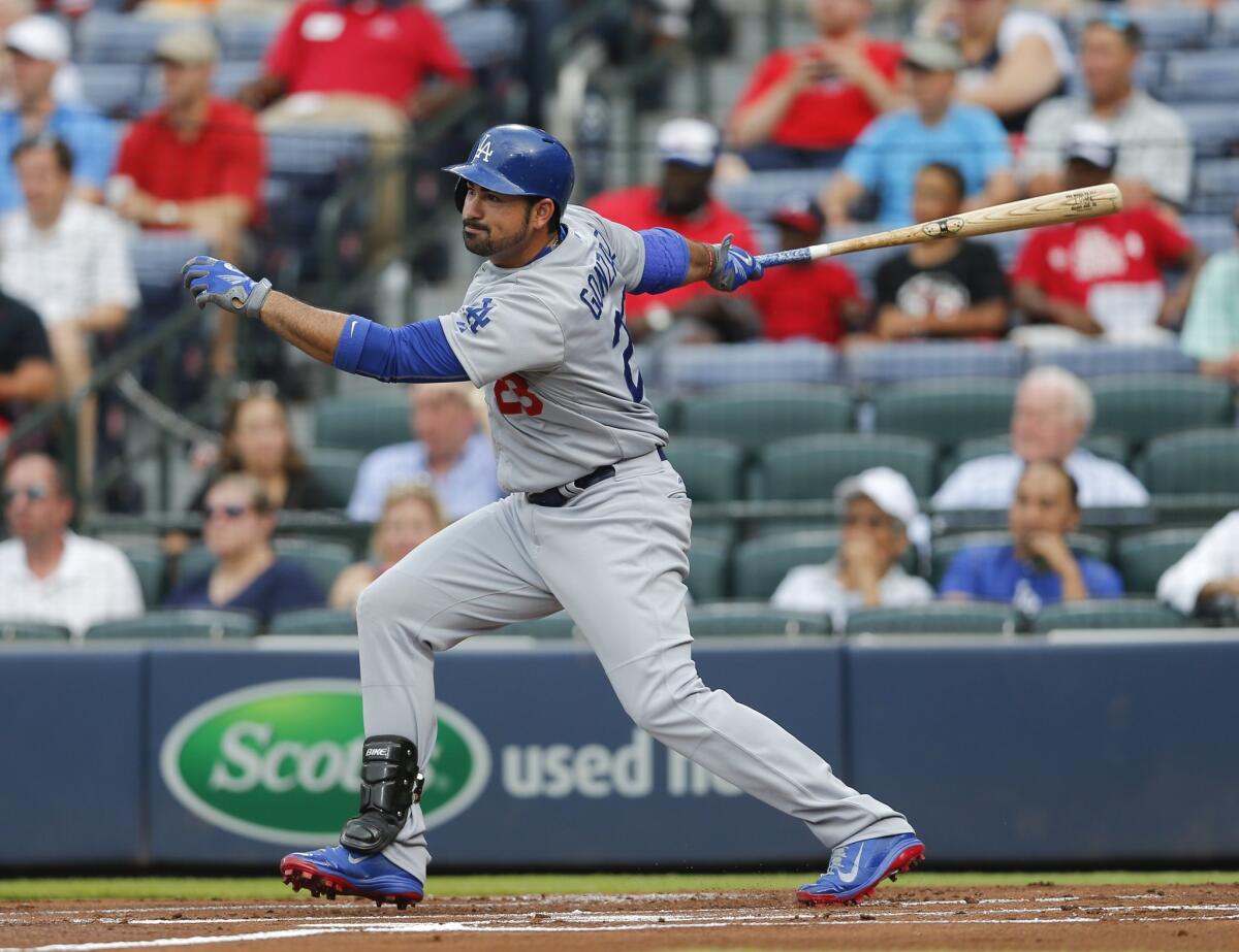 Los Angeles Dodgers first baseman Adrian Gonzalez (23) follows through in the first inning of a baseball game against the Atlanta Braves Monday, July 20, 2015, in Atlanta. (AP Photo/John Bazemore)