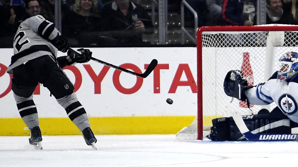 Kings right wing Marian Gaborik scores against Winnipeg goalie Michael Hutchinson during the first period Saturday.