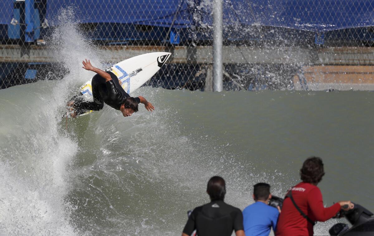 Kanoa Igarashi, of Huntington Beach, turns high off the top of the 700-yard, high-performance, bi-directional wave that features barrel sections and maneuver sections at the WSL Surf Ranch.