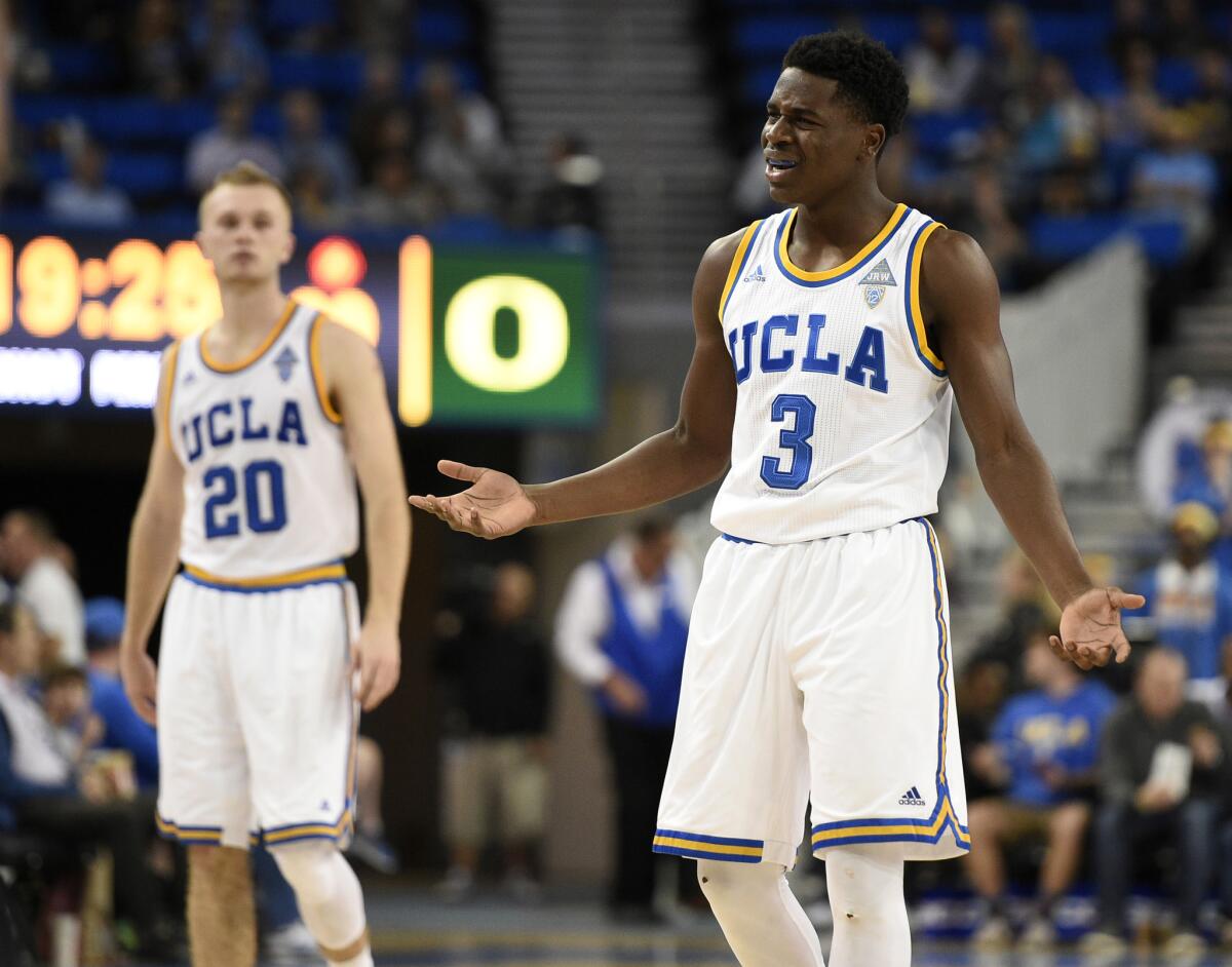 UCLA guard Aaron Holiday (3) reacts to a foul as guard Bryce Alford (20) watches during the second half.