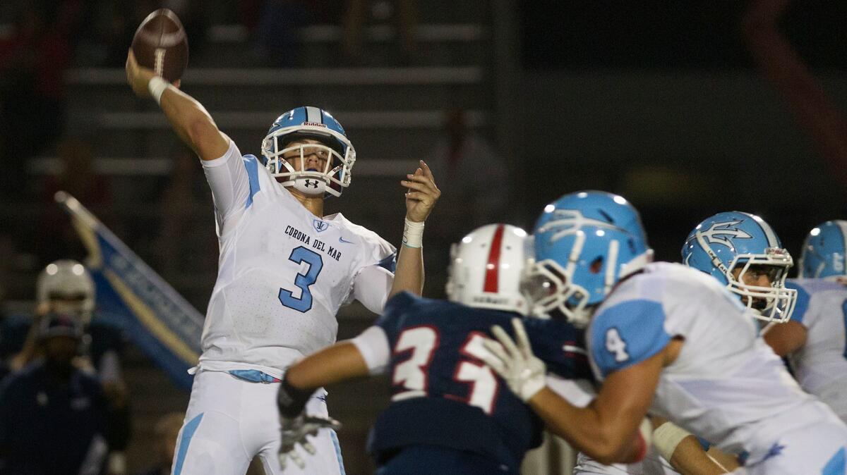 Corona del Mar quarterback Chase Garbers throws a touchdown pass against Beckman on Oct. 13.