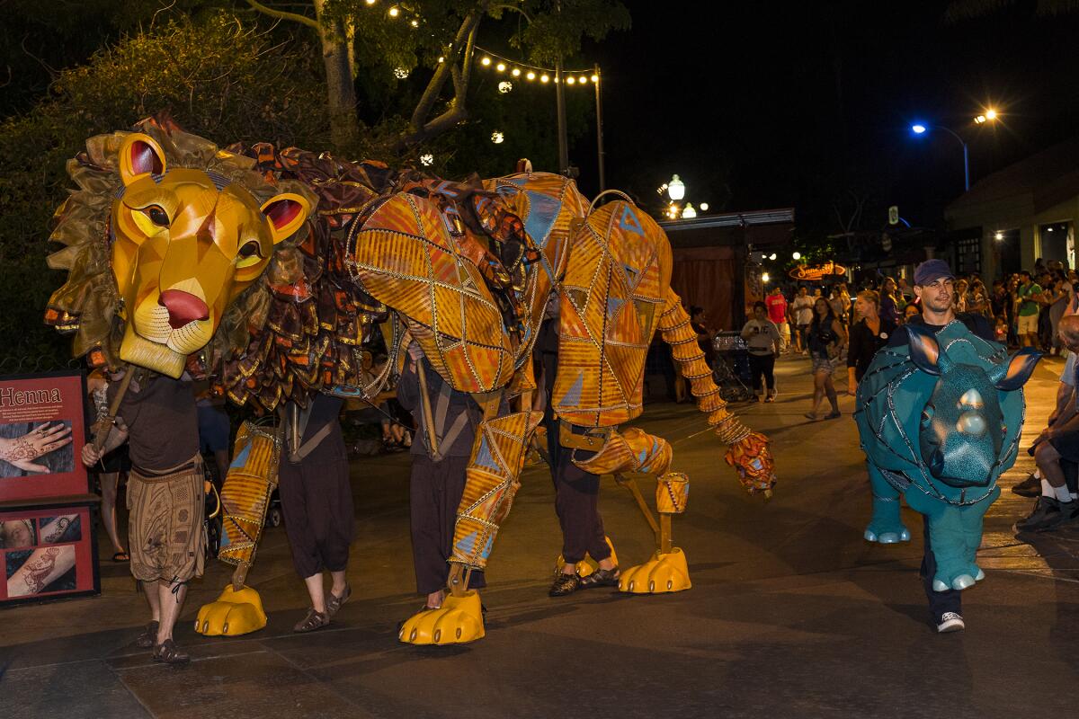 Activities featured in the San Diego Zoo's Nighttime Zoo include the twice-nightly Jambo Dunia! interactive parade.