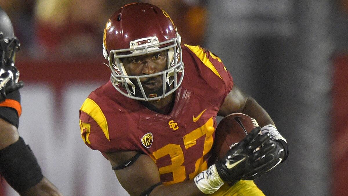 USC running back Javorius Allen carries the ball during Saturday's win over Oregon State.