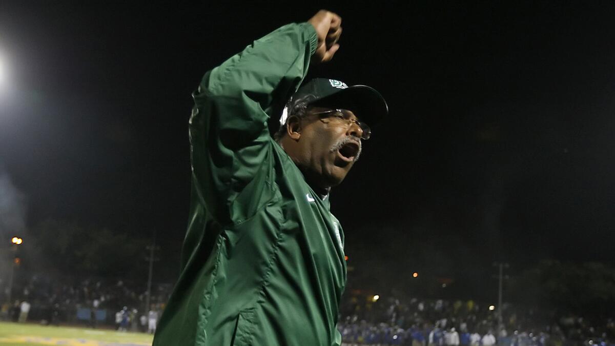 Former Dorsey football Coach Paul Knox reacts on the sideline before the opening kickoff against Crenshaw in November 2009.