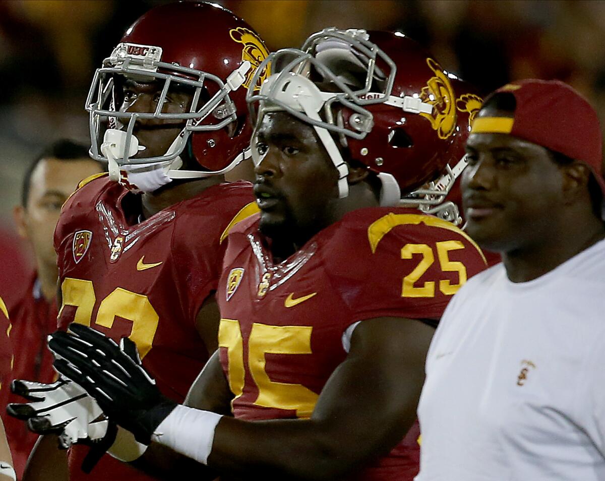 USC tailback Silas Redd waits on the sideline during a game against Arizona on Oct. 10, 2013.