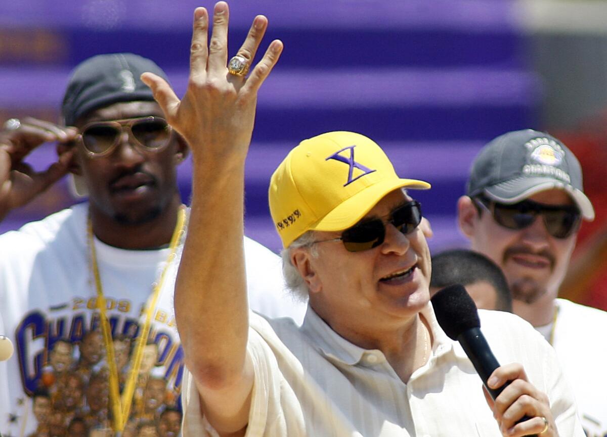Former Lakers Coach Phil Jackson shows off one of his NBA championship rings during the Lakers championship celebration in 2009.