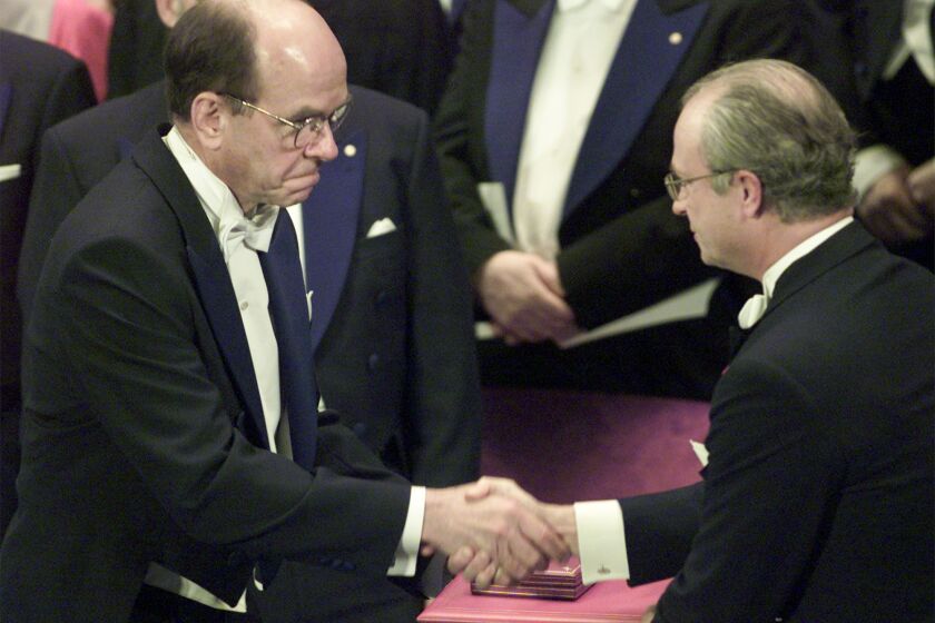 K. Barry Sharpless receives the 2001 Nobel in chemistry from Swedish King Carl XVI Gustaf. AP