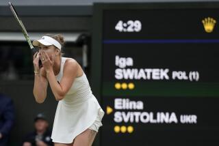 Ukraine's Elina Svitolina celebrates after beating Poland's Iga Swiatek to win their women's singles match on day nine of the Wimbledon tennis championships in London, Tuesday, July 11, 2023. (AP Photo/Kirsty Wigglesworth)