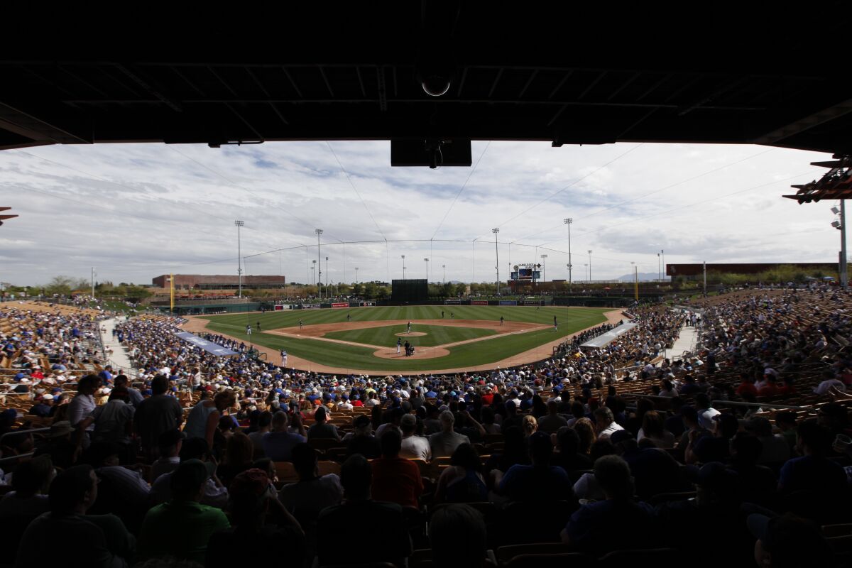 Fans watch a spring exhibition baseball game at Camelback Ranch between the Dodgers and Chicago White Sox in 2014.