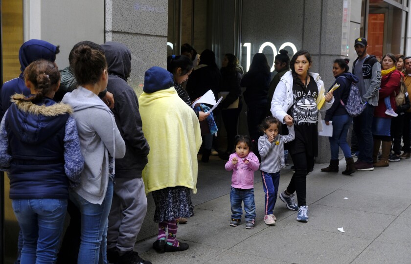 The line of people outside a U.S. immigration office in San Francisco stretches down the block on Jan. 31, 2019.