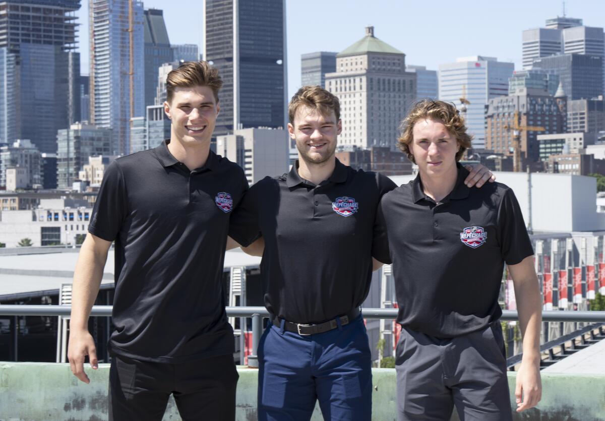 Juraj Slafkovsky, left, Shane Wright, center, and Logan Cooley, right, pose at the NHL Draft top hockey prospects media availability, Wednesday, July 6, 2022, in Montreal. (Ryan Remiorz/The Canadian Press via AP)