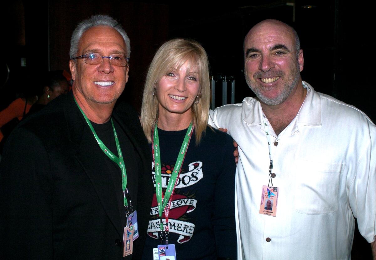 Three people at an awards show