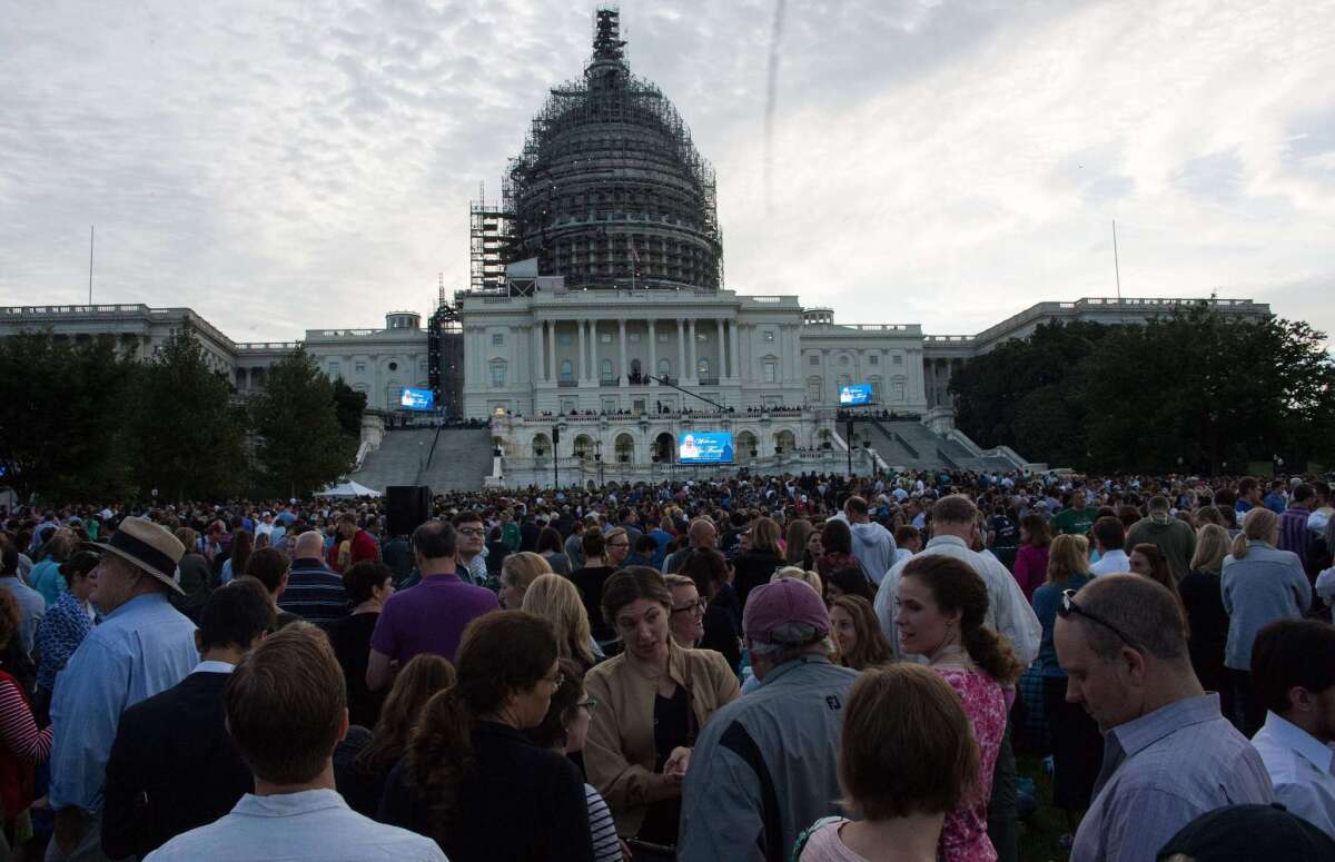 People gather in front of the Capitol in Washington before Pope Francis addresses a joint meeting of Congress.