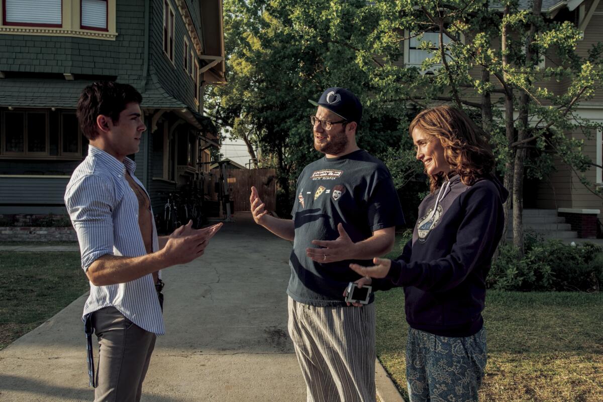 Zac Efron, from left, Seth Rogen and Rose Byrne in a scene from "Neighbors."