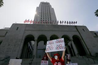 LOS ANGELES, CALIF. - APR. 30, 2020. Tenants and their supporters from across Los Angeles gather at city hall on Thursday, Apr. 30, 2020, to call on L.A. Mayor Eric Garcetti, the L.A. City Council, and California Gov. Gavin Newsom to cancel rent and mortgage payments during the COVID-19 crisis. (Luis Sinco/Los Angeles Times)