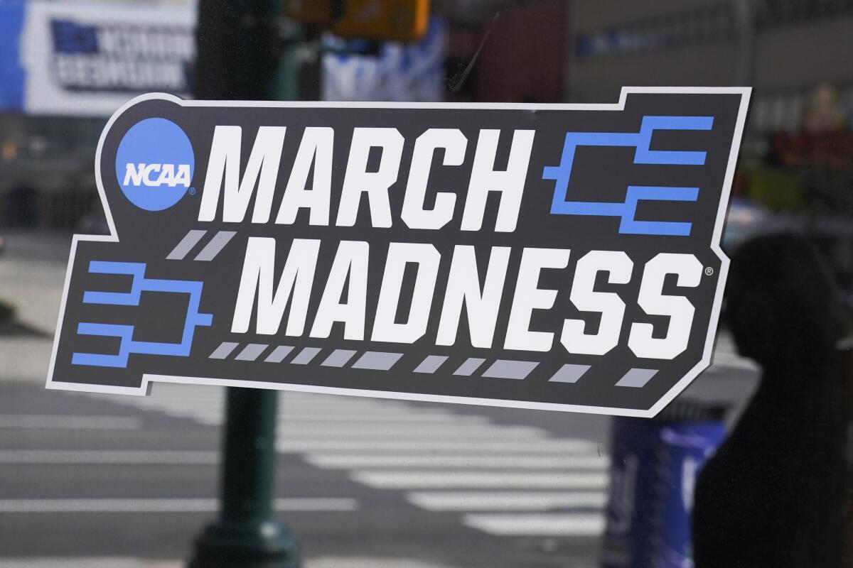 A March Madness sticker for the NCAA college basketball tournament is placed on a window.