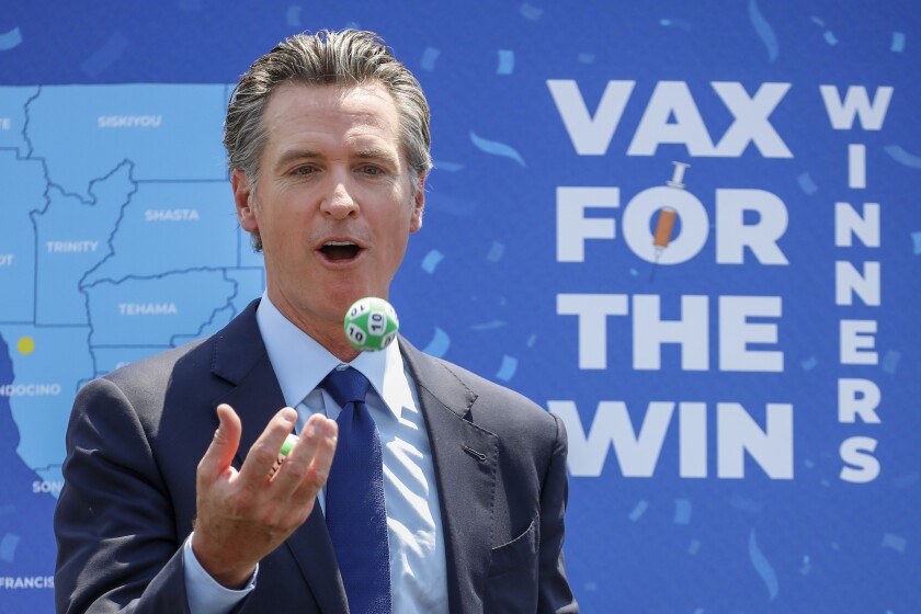 3 in 5 Californians now at least partially vaccinated
against COVID-19 2 Gov. Gavin Newsom juggles numbered balls following the conclusion of a press conference at Universal Studios