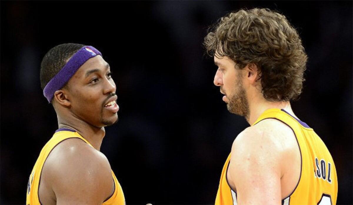 Dwight Howard and Pau Gasol celebrate their win against the Nets on Tuesday.