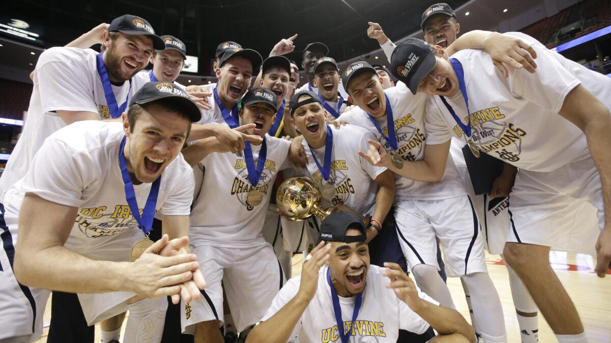 UC Irvine players celebrate the team's 67-58 win over Hawaii for the Big West Conference tournament championship in Anaheim on March 14.