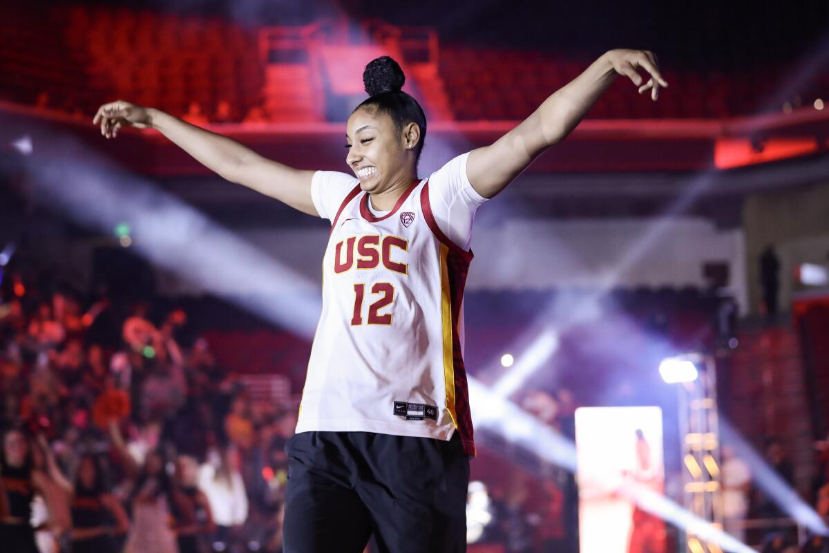 USC freshman JuJu Watkins waves to the crowd during the Trojan HoopLA event at Galen Center on Oct. 19.