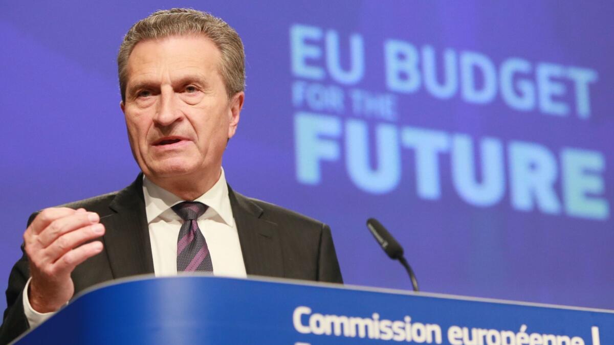 EU Budget Commissioner Guenther Oettinger unveils his proposal for the European Union's long-term budget post Brexit at a May 2 news conference in Brussels.