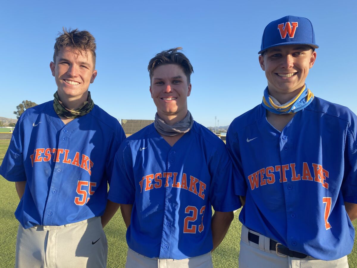 Jack Johnson, center, stands with his freshman twin brothers Nolan, left, and Nate.