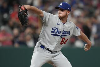 Los Angeles Dodgers' Caleb Ferguson pitches to a Cleveland Guardians batter during the seventh inning of a baseball game Tuesday, Aug. 22, 2023, in Cleveland. (AP Photo/Sue Ogrocki)
