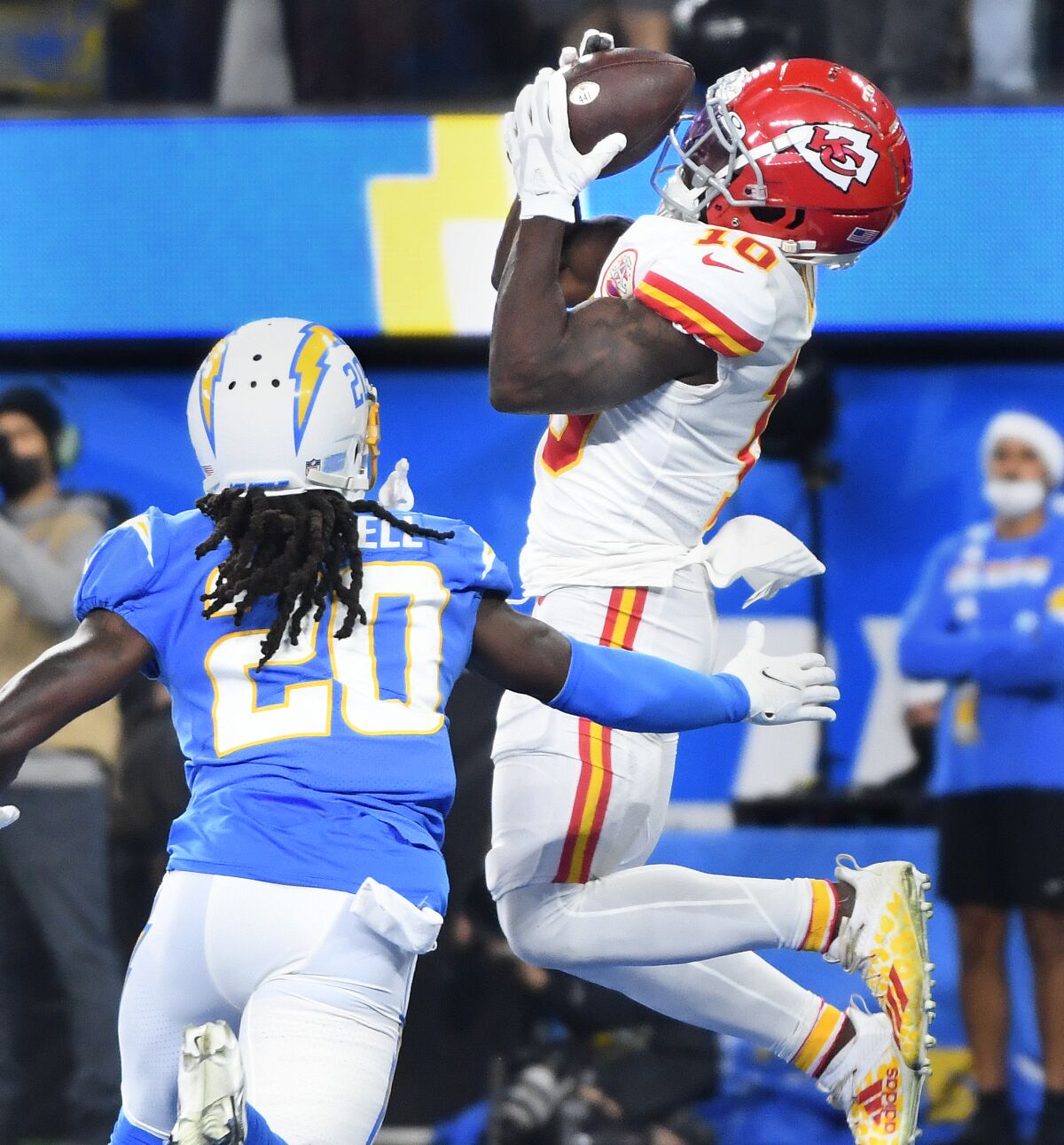Chiefs receiver Tyreek Hill catches a touchdown pass in front of Chargers cornerback Tevaughn Campbell.