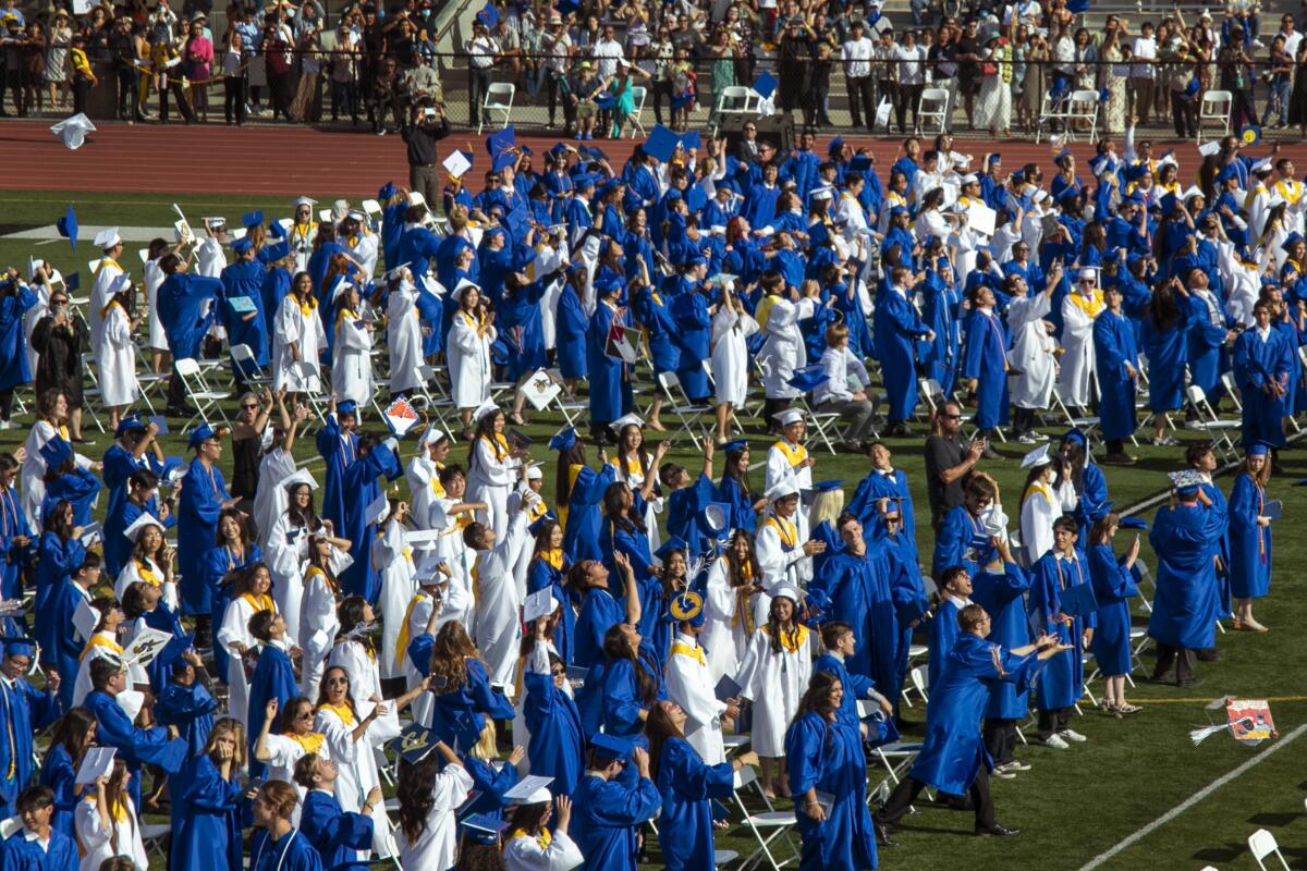 Caps fly as the Fountain Valley graduation reaches its conclusion.