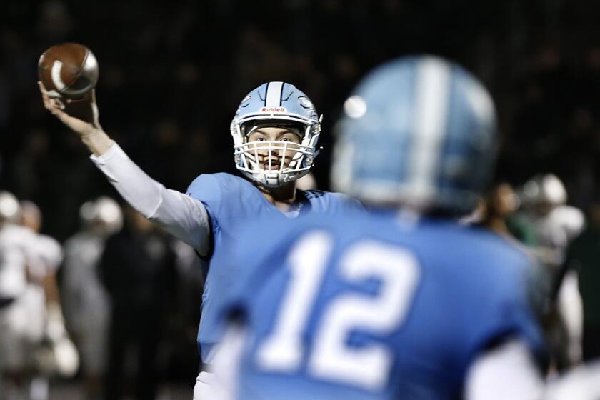 Corona del Mar quarterback Ethan Garbers fires a pass to Simon Hall against Oceanside in the CIF State Southern California Regional Division 1-A Bowl Game at Newport Harbor High on Saturday. PHOTO BY CHRISTINE COTTER/CONTRIBUTING PHOTOGRAPHER