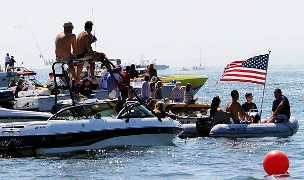 Spectators prepare to watch the 63rd Catalina Water Ski Race in Long Beach on Saturday. The event is a 62-mile round trip to Avalon and back to the finish line at the Queen Mary.