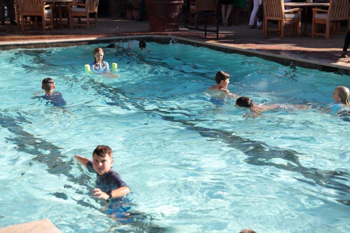 Students enjoying a "Newcomers' Welcome Pool Party" in 2019.