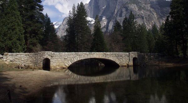 The historic Stoneman Bridge spans the Merced River in Yosemite National Park. Three of the park's bridges are facing removal.