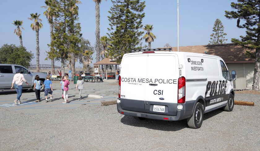 A CMPD crime scene van outside the O.C. Model Engineers' train facility at Fairview Park in Costa Mesa on Dec. 1.