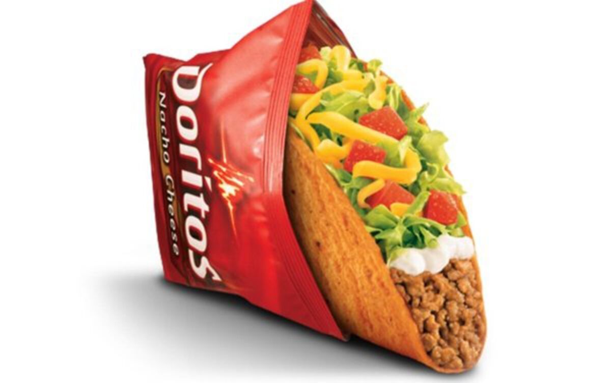 A Taco Bell Doritos Loco Taco is shown. Taco Bell is explaining the makeup of the meat it uses in such tacos.