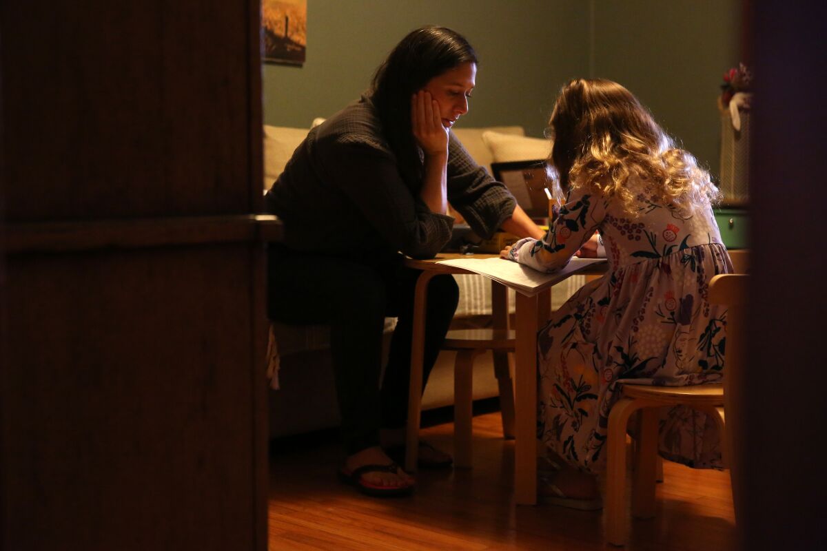 Cindy Carcamo crafts with her 5-year-old daughter at home in Santa Ana