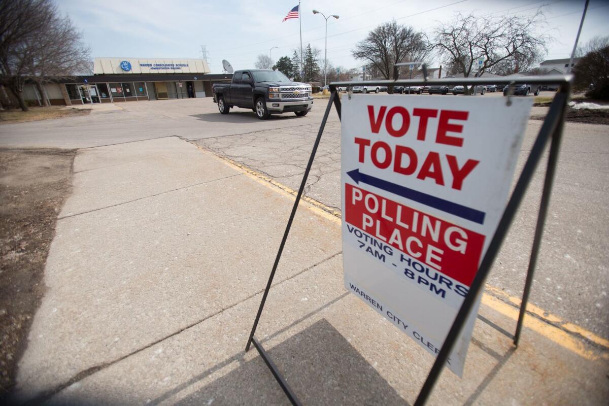 A truck leaves a polling place in Warren, Michigan on March 8, the day Michigan residents voted in their presidential primary.