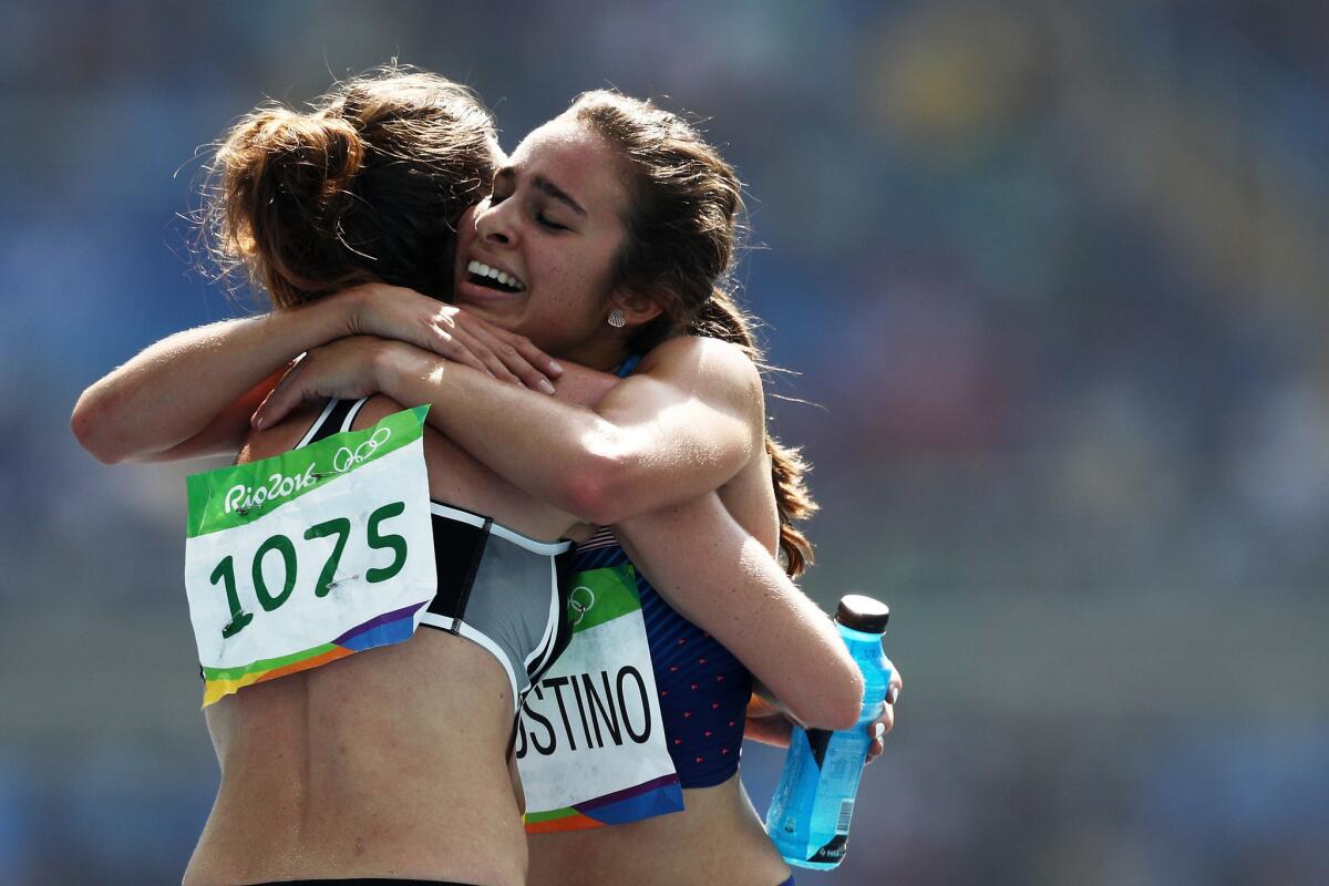 Abbey D'Agostino, right, hugs Nikki Hamblin after their women’s 5,000-meter event on Tuesday.