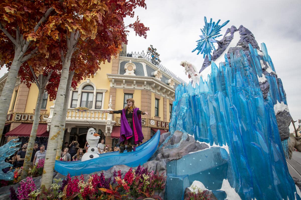 Olaf, Anna and Elsa perform on a float inspired by "Frozen II"