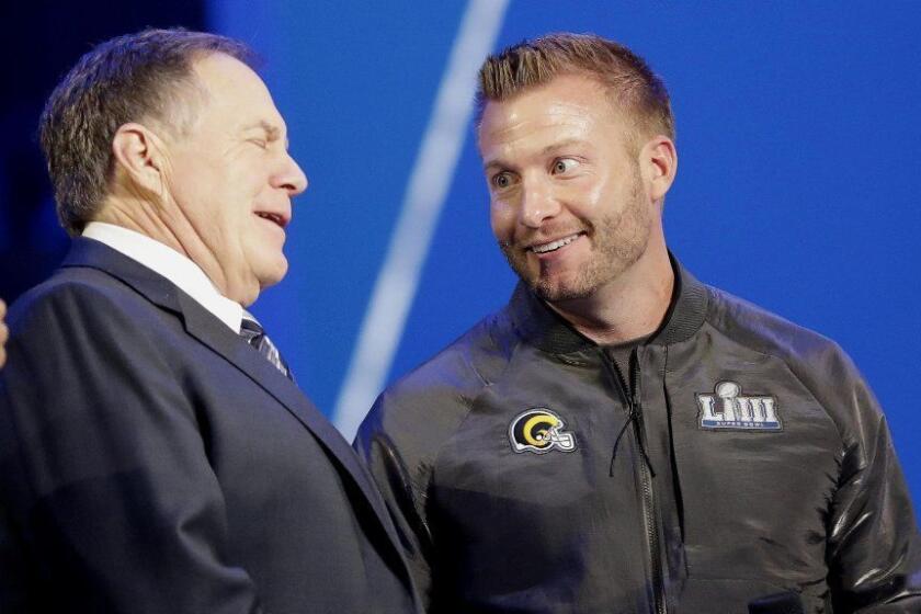 Los Angeles Rams head coach Sean McVay, right, speaks with New England Patriots head coach Bill Belichick during Opening Night for the NFL Super Bowl 53 football game Monday, Jan. 28, 2019, in Atlanta. (AP Photo/David J. Phillip)